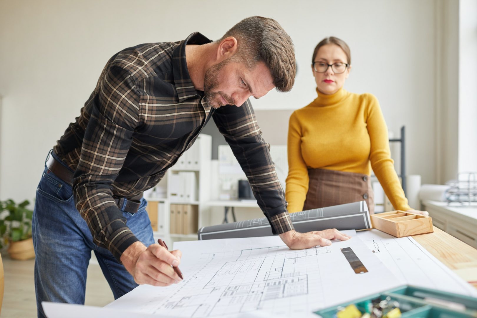 Male Architect Working at Drawing Desk